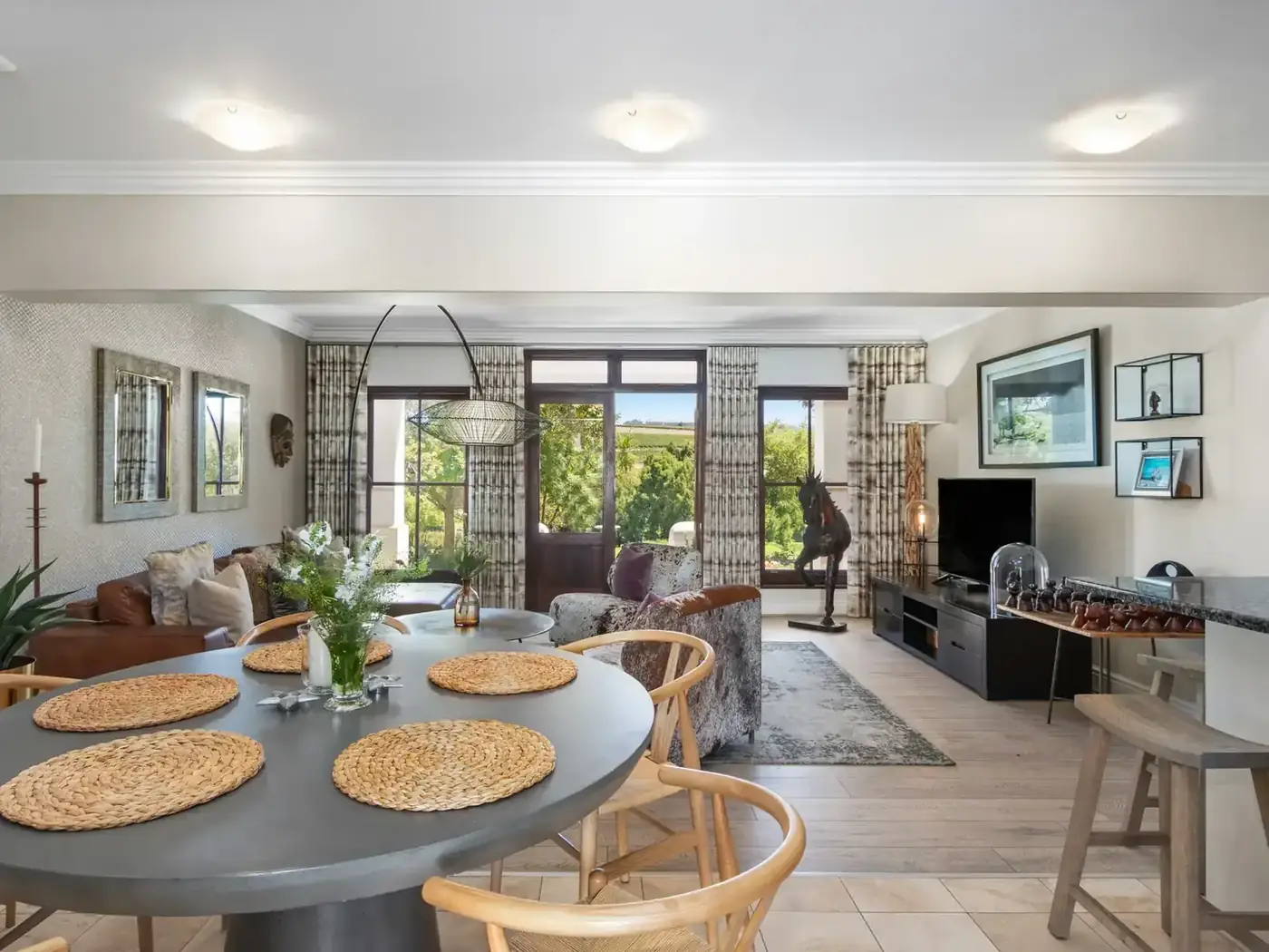 Dining area with round table and vineyard views