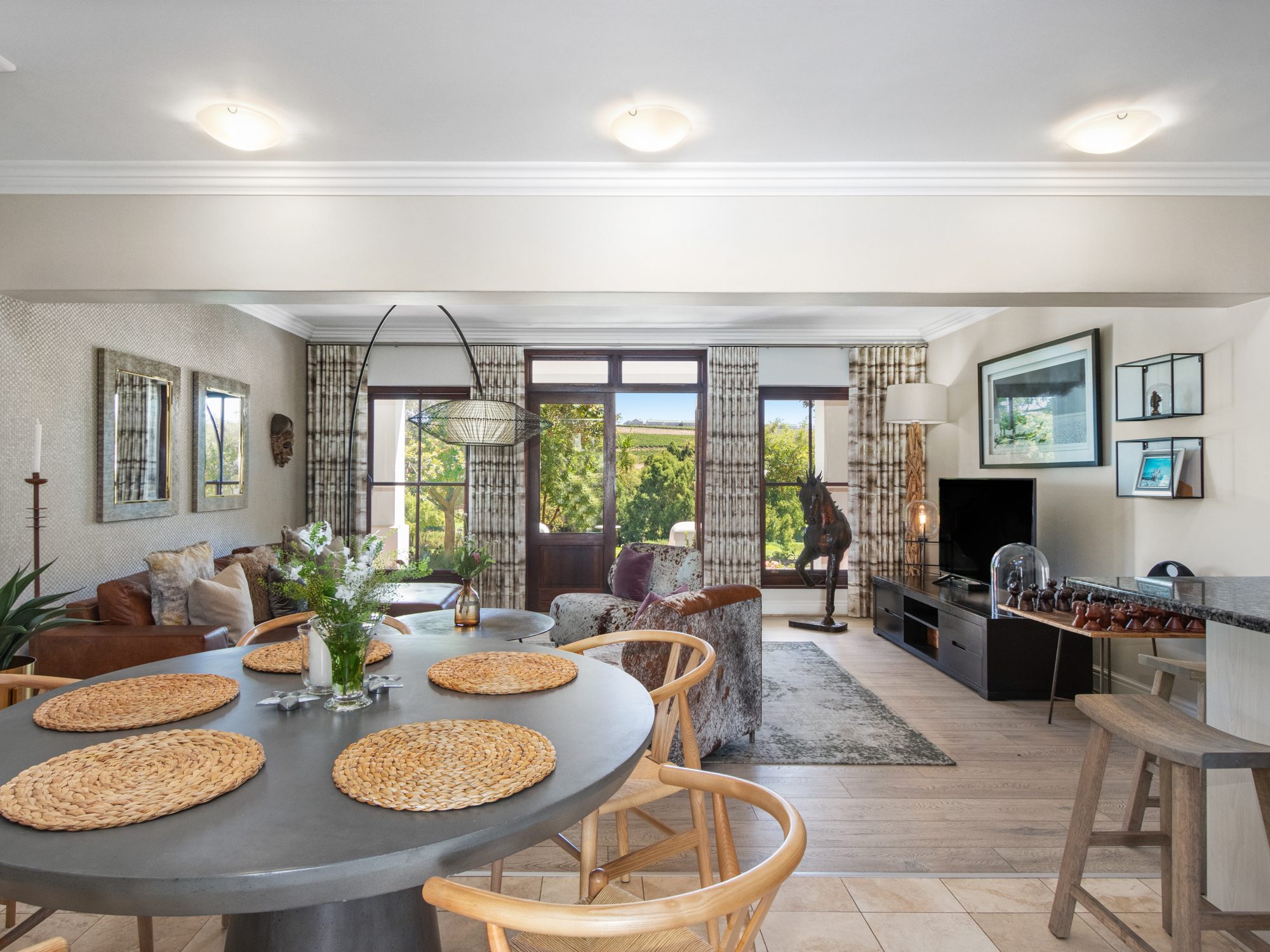 Dining area with round table and vineyard views