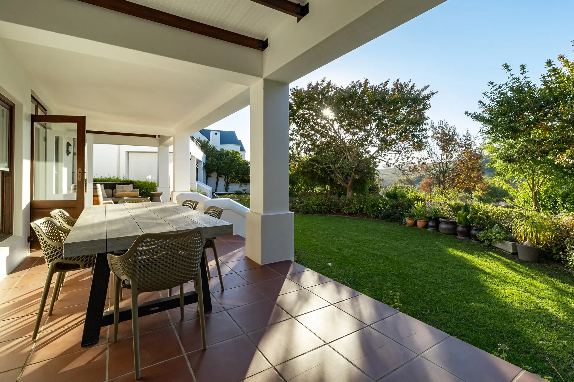 Lodge 2 — lodge-2-stoep-table-and-garden-view