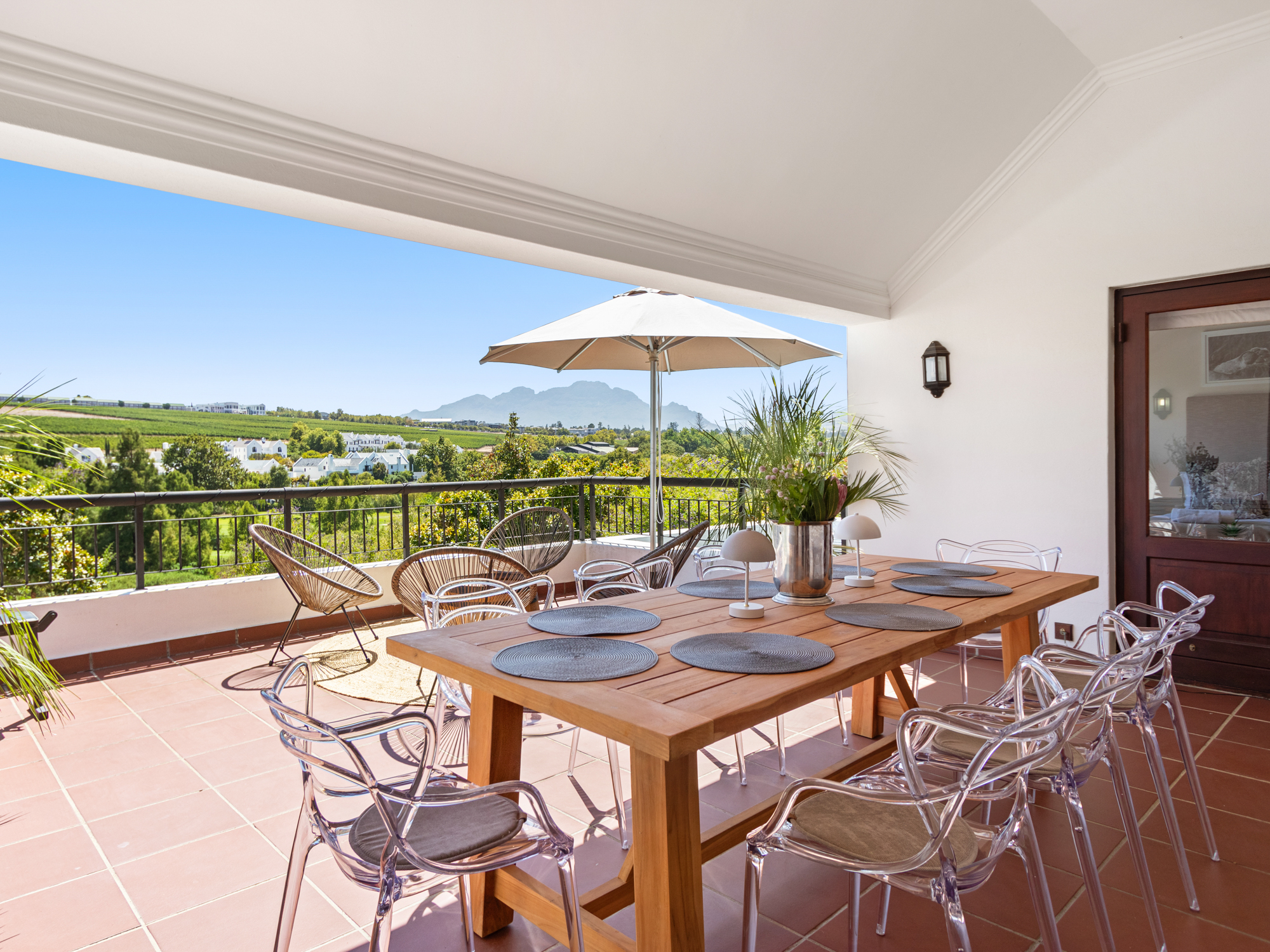 Covered terrace dining with mountain panorama
